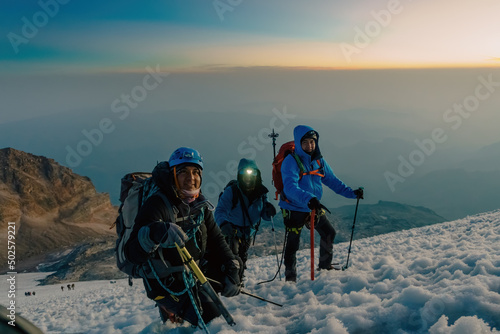 three climbers on the glacier of the pico de orizaba volcano