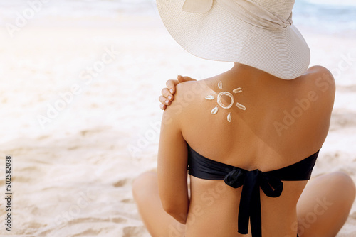Suncream. Suntan Lotion Beautiful Woman Applying on beautiful on Shoulder. Sunscreen Solar Cream. Skin care. Sun protection