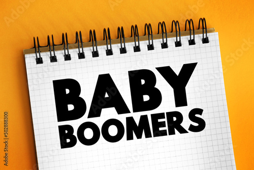 Baby boomers - demographic cohort following the Silent Generation and preceding Generation X, text concept on notepad