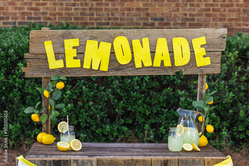 An empty lemonade stand ready for children to start selling lemonade on a hot summer day as their first business endeavor