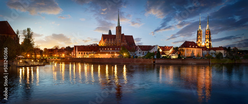 Panoramic evening view on Wroclaw Old Town. Island "Ostrow Tumski’’.and Cathedral of St John with bridge through river Odra. Wroclaw, Poland.