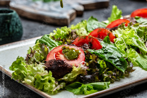Chicken liver and salad leaves, parmesan cheese and cherry tomatoes. Delicious balanced food concept