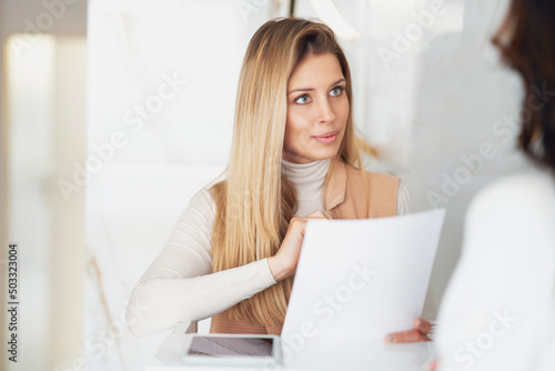 Young nice receptionist woman in salon spa or hotel