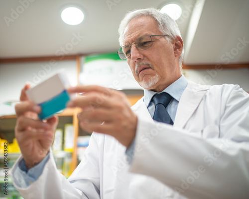 Pharmacist looking at a medicine