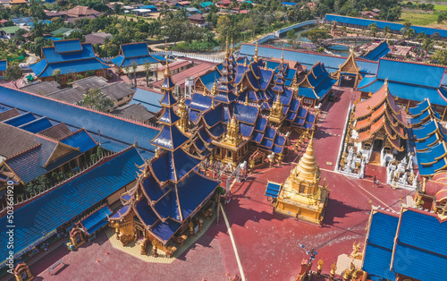 Aerial view of Wat Phiphat Mongkhon blue temple in Sukhothai, Thailand