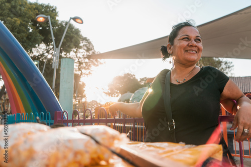 Itinerant fruit vendor in a park in Managua Nicaragua smiling at sunset. Concept of self-employment