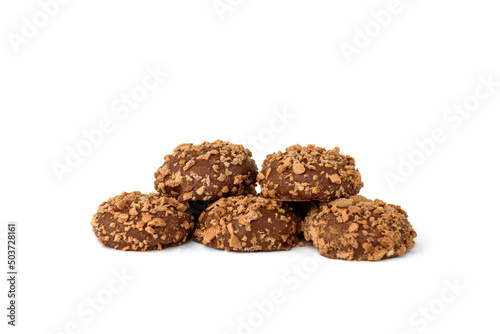 Shortbread cookies in milk chocolate glaze and crumbs isolated on white background.