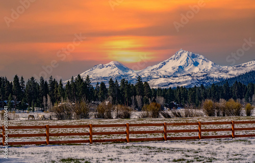 The Three Sisters mountains at Sunset viewed from Black Butte Ranch near town of Sisters in Central Oregon