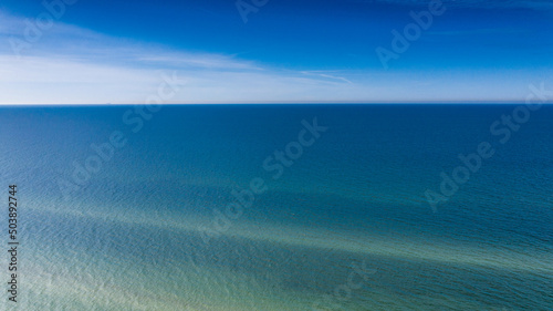 Blue sea water and blue sky in a sunny day.