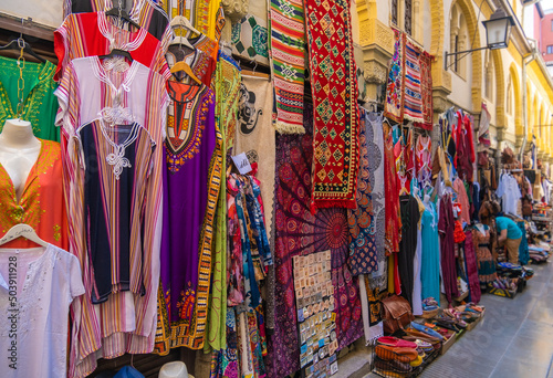 GRANADA, SPAIN - SEPTEMBER 25, 2021: Tourists at the old Alcaiceria arab market.