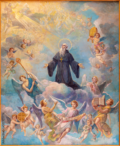 BARI, ITALY - MARCH 3, 2022: The ceiling paintin of Apotheosis of St. Benedict in the church Chiesa di Sacro Cuore by Umberto Colonna from 20. cent.