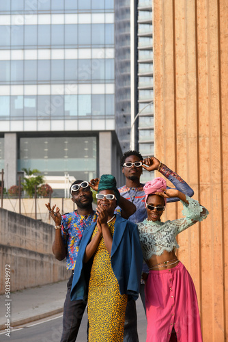 Fashion portrait of four people in urban street