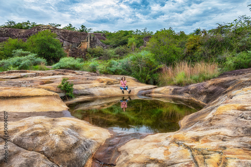 On the way to the rock arch you pass the mirror lagoon of the rocky plateau of Cerro Arco in Tobati, Paraguay.