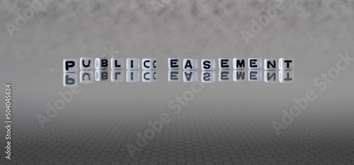 public easement word or concept represented by black and white letter cubes on a grey horizon background stretching to infinity