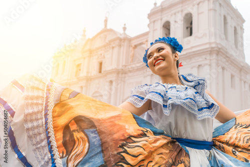 Traditional dancer with a typical Nicaraguan costume dancing outside the cathedral of Leon Nicaragua celebrating the independence