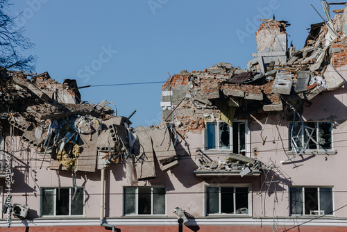 The ruins of the Hotel Ukraine against the blue sky in the city of Chernihiv during Russia's war against Ukraine in 2022. Destroyed roof, walls, windows of buildings. Airstrike