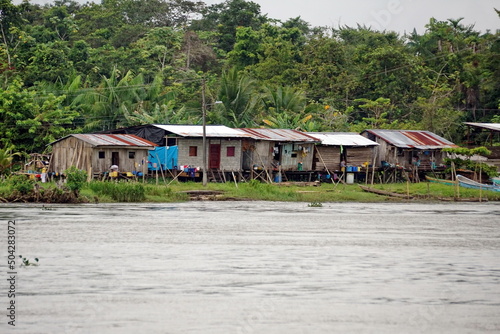 Houses on the bank of the river in the jungle outside of San Lorenzo, Ecuador