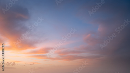 Colorful pastel sky with clouds at beautiful sunset as natural background.