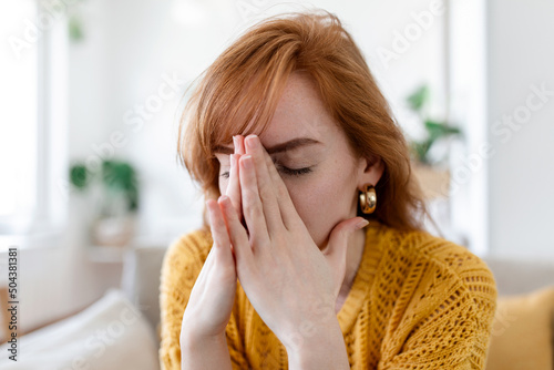 Sad woman feels miserable desperate sit on sofa look out the window thinking about personal troubles does not see way out of difficult life situation. Break up, heartbreak, cheated girl concept