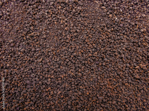 Pile of dry tea (Chai Patti) seeds. Black tea powder