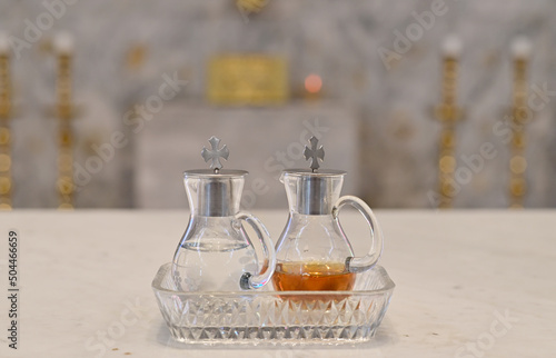 Closeup of Holy Wine and water in a small clear glass bottle to become the blood of Jesus Christ for performing Catholic religious ceremonies (Mass) at Thailand.
