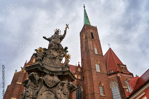 Sculpture of John of Nepomuk in front of the Church of the Holy Cross aka St. Bartholomew's in Wroclaw, Poland