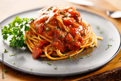 spaghetti tomato sauce with chopped parsley.
