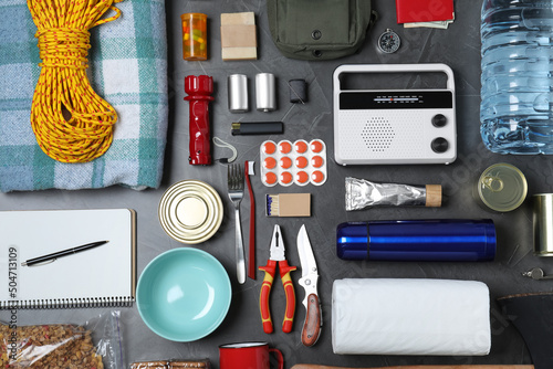 Disaster supply kit for earthquake on dark grey table