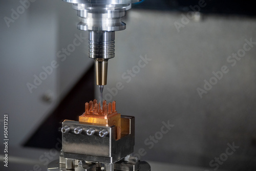 The CNC milling machine cutting the copper electrode parts with sloid ball endmill.