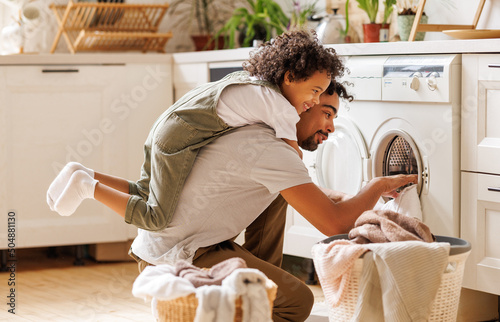 Father and son doing laundry together