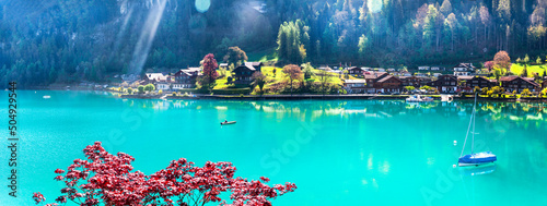 Stunning idylic nature scenery of mountain lake Brienz . Switzerland, Bern canton. Iseltwald village surrounded turquoise waters