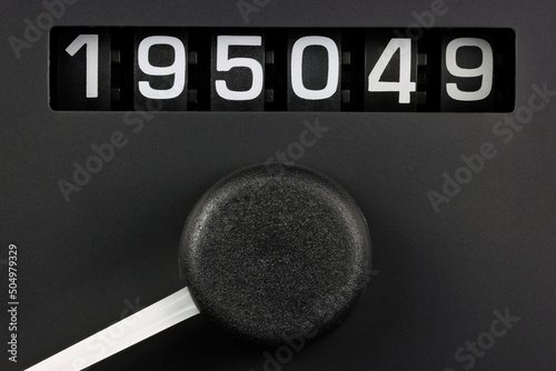 odometer of used car showing mileage of 195049 km