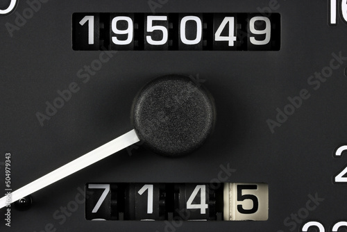 odometer of used car showing mileage of 195049 km