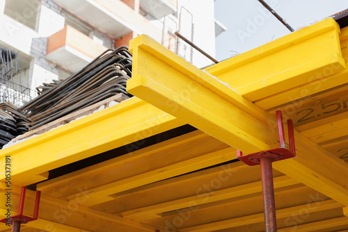 construction of an industrial plant floors with yellow i-beams. Preparing the formwork for pouring concrete.