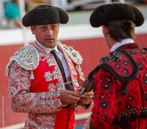 close up of a bullfighter speaking with his partner