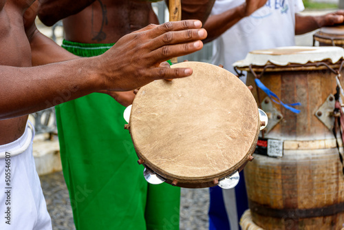 Group of musicians playing tambourine and atabaque in the famous streets of Pelourinho in Salvador, Bahia