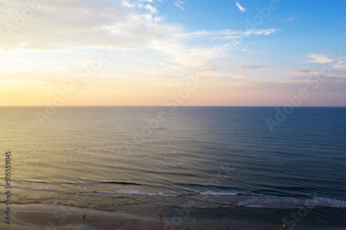 Aerial view of sunset at sea, waves and beach on Hilton Head Island, South Carolina