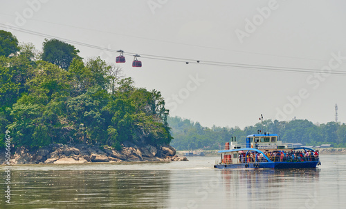 Passenger ferry departs from the Umananda temple island 