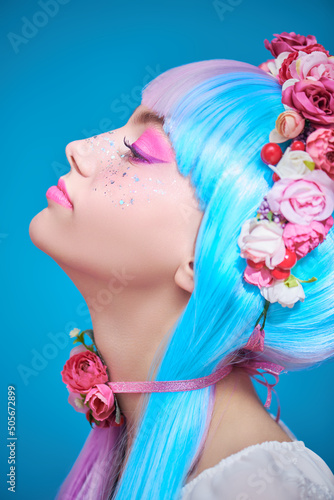 teen girl in multicoloured wig