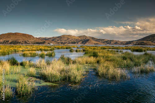 The floating village of Uros on Lake Titicaca, Peru. Lake Titicaca is the largest lake in South America and the highest navigable lake in the world.