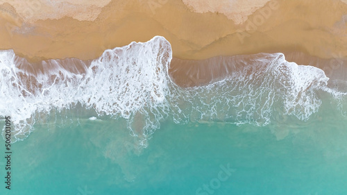 Coast as a background from aerial top view. Beach as wave Turquoise water background in Summer seascape
