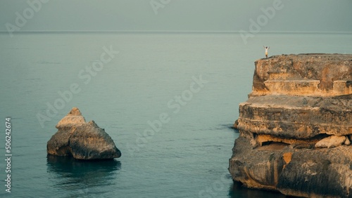 beautiful panorama, that italian paradise in Puglia. there's a big cliff on that beautiful sea. the shooting was made on a blue hour, after sunset, for shooting a natural till and orange effect.