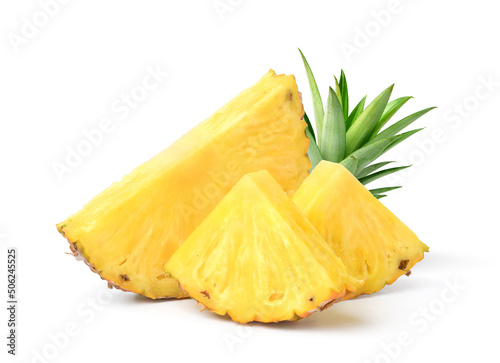 Pineapple with cut in half and slices isolated on white background.