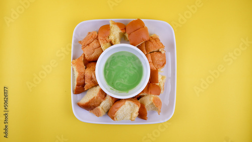 "Roti kukus kaya" isolated with yellow background.