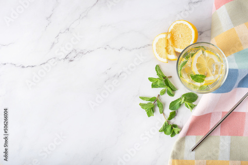lemonade with mint and lemon on white marble table