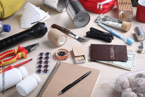 Disaster supply kit for earthquake on wooden table