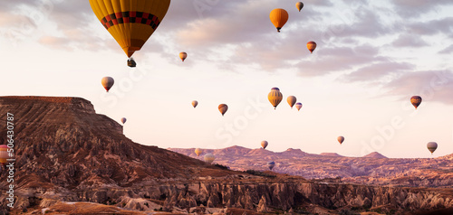 Panoramic view of hot air balloons flying during festival in Cappadocia, Turkey