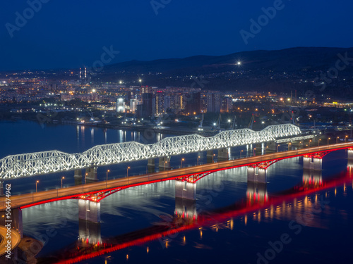 Siberian city of Krasnoyarsk. Top view of the Yenisei River and bridges. Night shooting