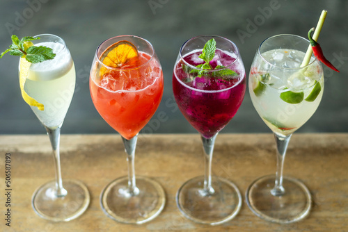 mixed spritzer wine cocktails selection with fruit in outdoor bar