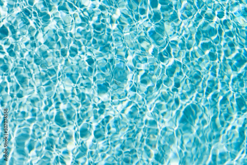 rippled water turquoise color in summer swimming pool